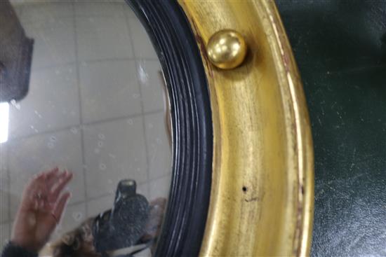 A Regency convex mirror with acanthus and eagle surmount H.3ft.